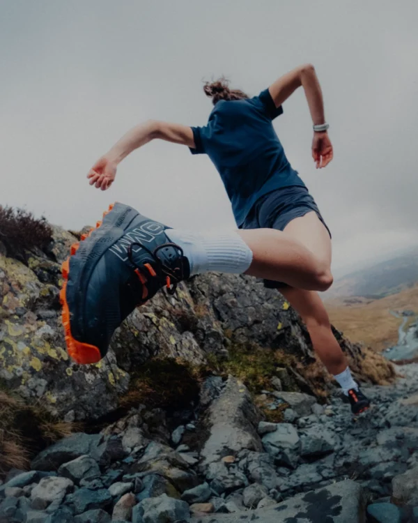 Runner moving over rocky ground