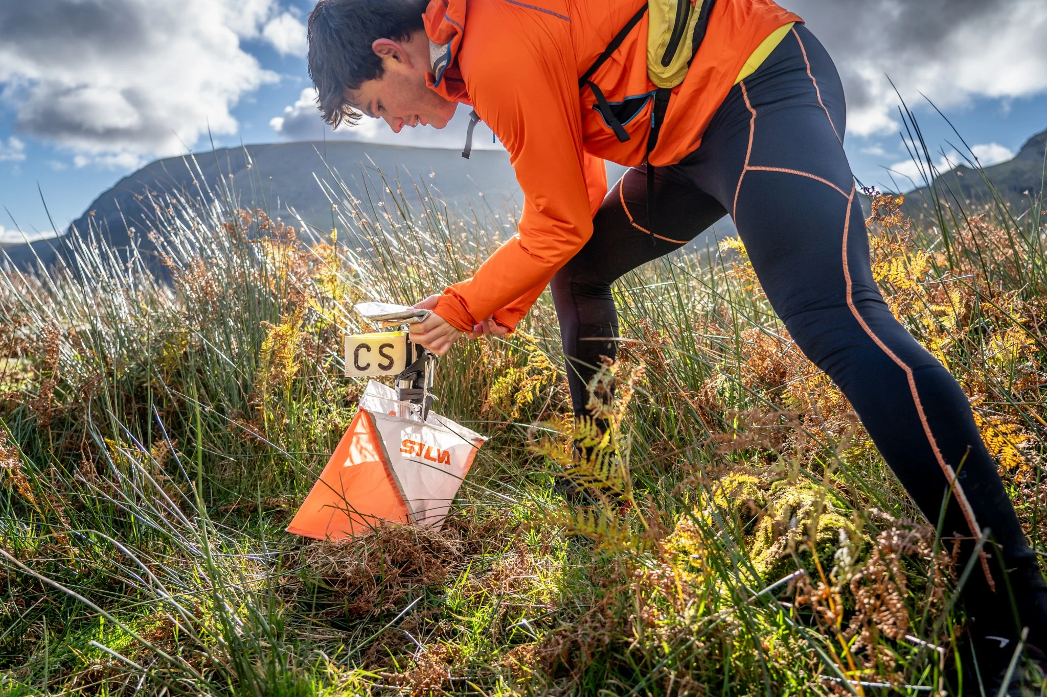 OMM competitor dibbing in to a checkpoint